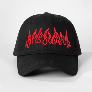 Close-up of red flame embroidery on high-quality black cotton baseball cap fabric