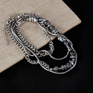 Silver multi-layer stainless steel necklace featuring Cuban chain and dark natural stone beads