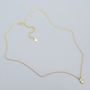 Detail view of gold S925 silver necklace with rectangular zircon and adjustable clasp