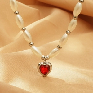 Faux pearl necklace with silver beads and a deep red heart crystal pendant in silver frame