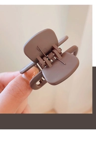 Detail of coffee brown matte shark hair clip with a strong metal spring mechanism