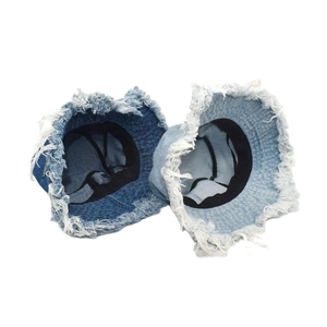 Frayed denim bucket hat for women in dark and light blue with vintage fringe brim