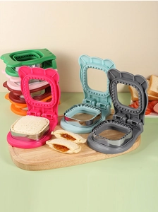Close-up of colorful DIY stainless steel sandwich cutters in green, pink, and blue