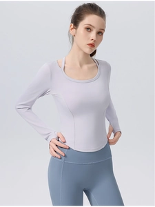 Detail of slim fit lavender yoga top with unique double shoulder straps and matte texture