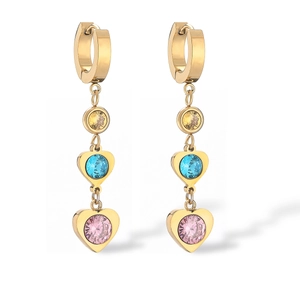 Detail of gold-plated titanium drop earrings with heart crystals and sparkling pearls