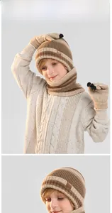 Detailed knit texture of kids' winter striped beanie, scarf and touchscreen glove set