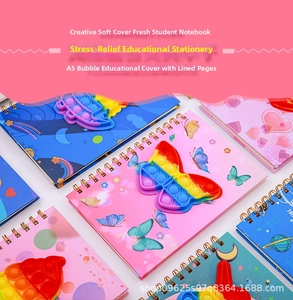 Detailed view of A5 spiral notebooks with colorful pop-it butterfly and space covers