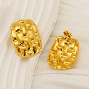 Detailed view of gold rectangular earrings with embossed weave texture and metallic finish