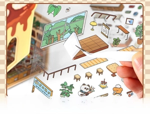 Macro shot showing tweezers peeling a PET cartoon sticker with thick white ink details