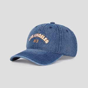 Detail of blue denim baseball cap with orange Los Angeles 83 3D embroidery detail