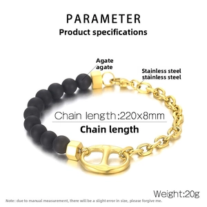 Detail of men's matte onyx bead and gold stainless steel link bracelet with pig nose charm