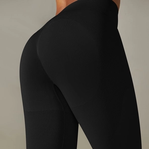Detail of seamless high-waist yoga leggings with honeycomb texture and push-up effect