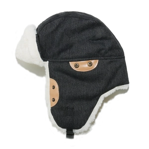 Detail of warm winter trapper hat with faux fur lining and adjustable ear flaps