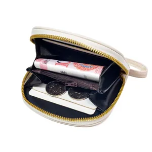 Cream white cartoon cow print accordion wallet with multiple slots and zipper pocket