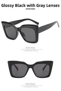 Detail view of large square cat-eye sunglasses with black frames and grey lenses