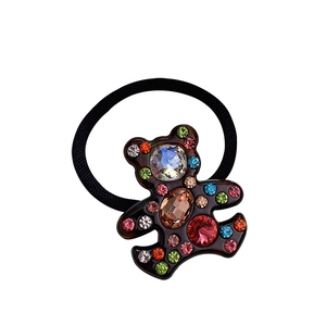 Sparkling rhinestone bear elastic hair tie with brown acetate finish on white background