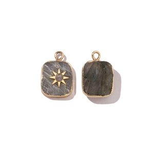 Polished stainless steel square charm with grey quartz and gold star inlay detail