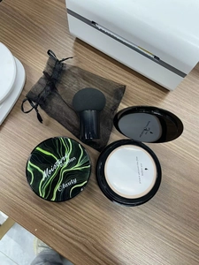 Moisture Cushion CC cream set with mushroom puff, mirror and drawstring pouch on wood
