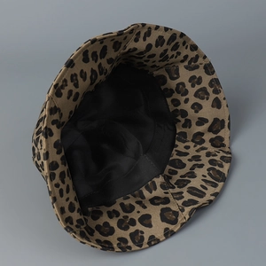 Fashionable leopard print bucket hat with ruffled edges and breathable black inner lining
