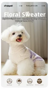 Close-up of stretchy knit pet sweater with floral pattern on soft purple and beige fabric