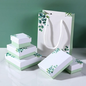 Minimalist white and green eucalyptus jewelry gift box set with matching paper bags