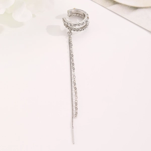 Detail view of silver long chain tassel ear cuff featuring sparkling white rhinestones