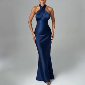 Detail of elegant dark blue satin halter dress with sleek neckline and glossy finish