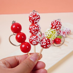 Miniature candied hawthorn keychain with glossy glaze and realistic fruit details