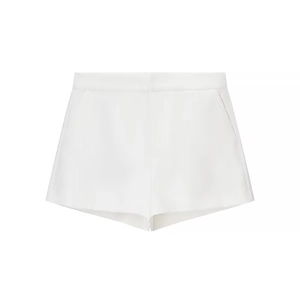Women's minimalist white high-waisted shorts with side pockets and button details