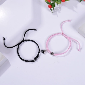 Detail view of woven heart magnet couples bracelets with projection bead technology