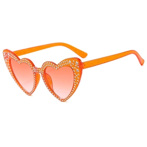 Sparkly orange heart-shaped sunglasses with rhinestones and glitter for women