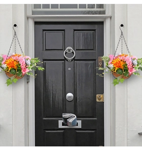 Detail of hanging artificial daisy flower baskets with colorful blooms for porch decor