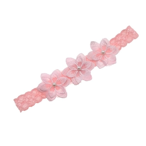 Detailed view of pink chiffon lace baby headband with three floral pearls embroidery