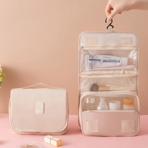 Hanging beige travel toiletry bag with waterproof fabric and multi-compartment storage