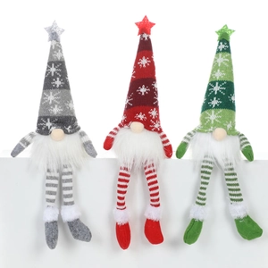 Three faceless Christmas gnomes with snowflake hats and glowing lights on white background