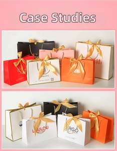 Detail of custom paper gift bags with elegant gold silk bow handles in multiple colors