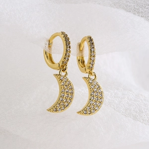 Exquisite 18K gold plated moon earrings with micro-inset zircons on white mesh background
