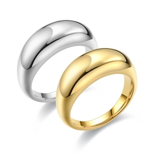 Polished teardrop stainless steel rings in gold and silver finish on white background