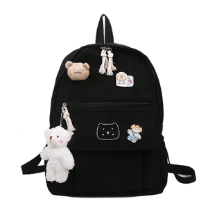 Black corduroy school backpack with cute bear patches and a plush bear keychain