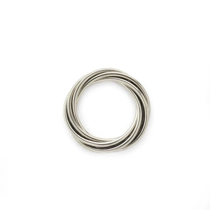 Macro detail of silver multi-layer spring coil design with metallic industrial texture