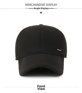 Detailed front view of black winter baseball cap with thick wool texture and metal badge