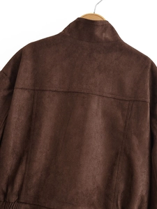Detail view of the back stitching and premium faux suede texture of the brown jacket