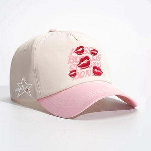 Baseball cap with red lips embroidery and Pussy Builds Strong Bones text in cream pink