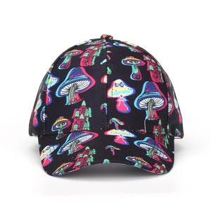 Detailed close-up of colorful mushroom print patterns on black baseball cap surface