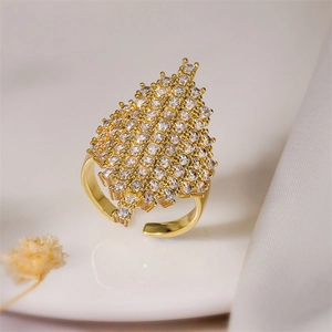 Detail of leaf-shaped gold ring with micro-pave zircons and adjustable open band