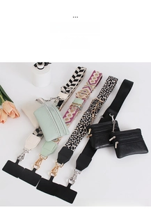 Detail of wide patterned crossbody phone straps with mini wallets and metal hooks
