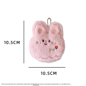 Detail of pink plush rabbit portable mirror with JOY embroidery and bead chain hook