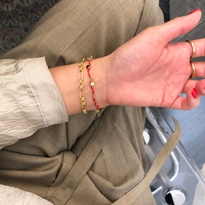 Minimalist 925 silver gold chain bracelet and red lucky rope worn together as a set