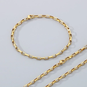 Detailed view of a gold-plated stainless steel box chain necklace with a lobster clasp