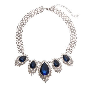 Vintage silver necklace with deep blue teardrop gems and sparkling diamonds